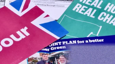 A candidate canvassing door-to-door on a residential street under grey skies