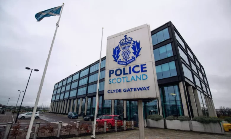 Police Scotland officers outside a government building in Edinburgh