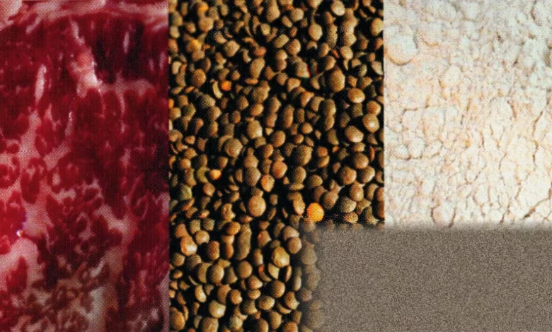 Fresh beef cuts displayed on a wooden chopping board in a kitchen