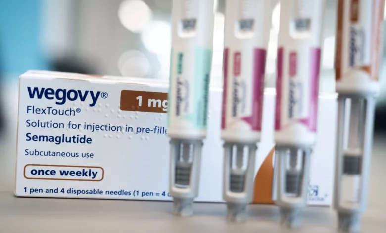 A researcher examining a vial of semaglutide medication in a laboratory setting