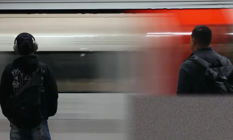 Passengers queuing at a Tube station entrance before planned strike disruption
