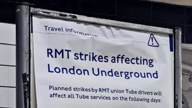 Commuters stand on a crowded London Underground platform during strike disruption.