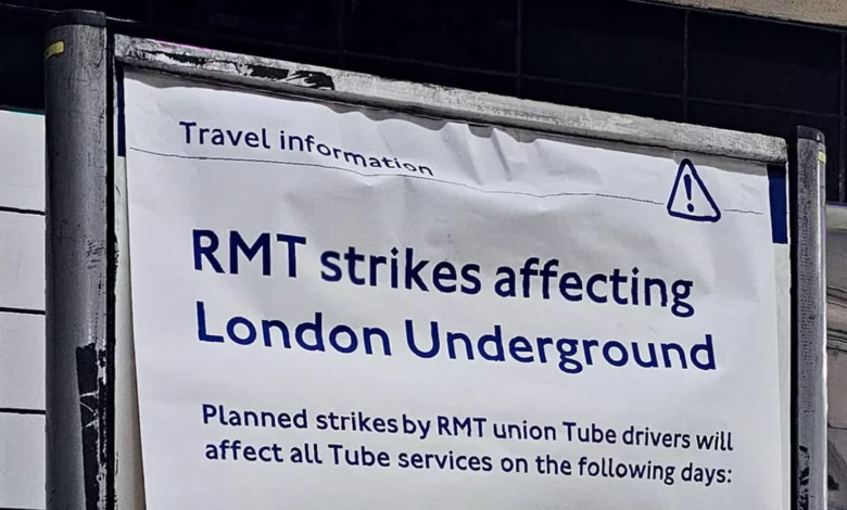 Commuters stand on a crowded London Underground platform during strike disruption.