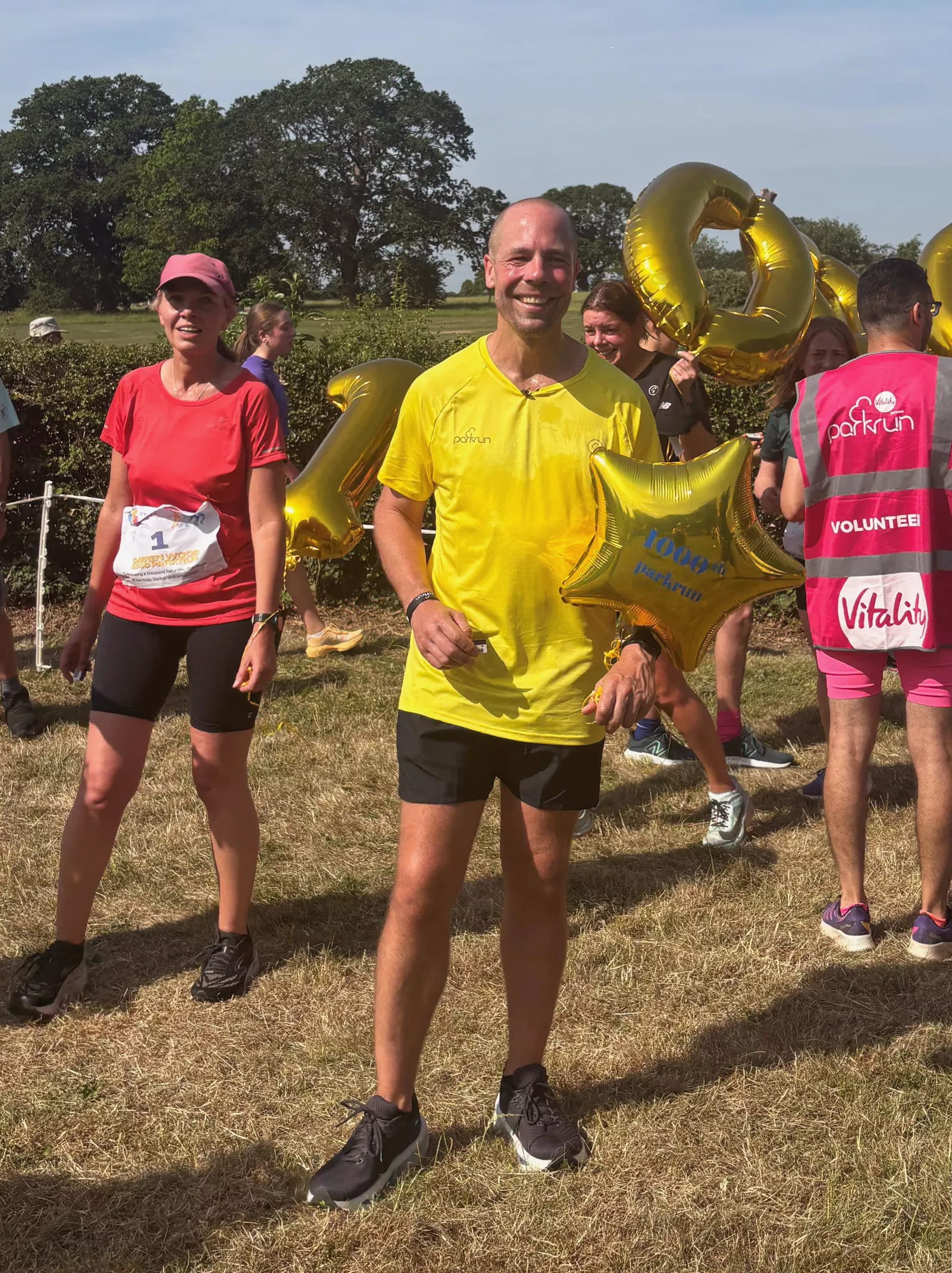 Wide view of Morden parkrun course with participants and spectators
