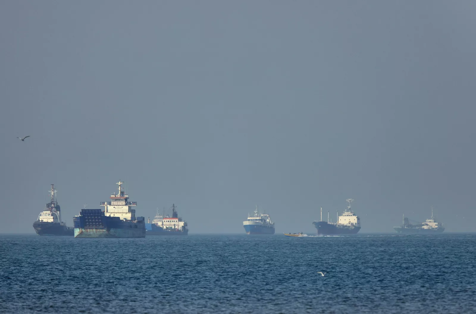 Oil tankers anchored near the Strait of Hormuz amid ongoing shipping disruption
