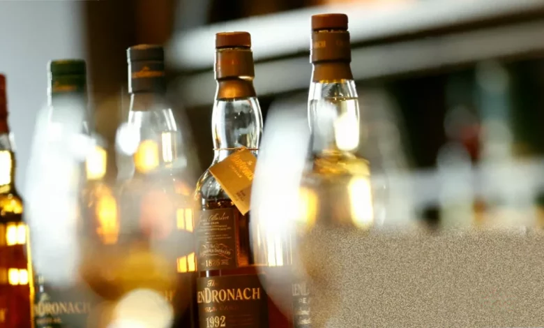 Distillery warehouses stacked with oak barrels maturing Scotch whisky