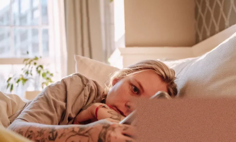 A researcher analysing sleep pattern data on a digital screen in a medical office