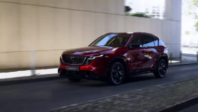 Mazda engineers working on software-defined vehicle development in a modern lab