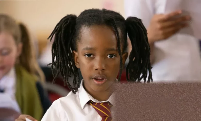 Children singing in a church choir rehearsal in south London
