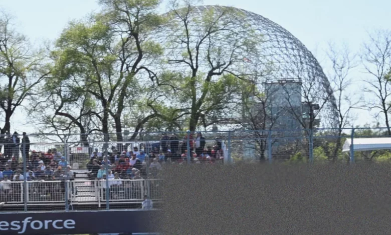 Two Mercedes cars parked on the starting grid at the Circuit Gilles Villeneuve in Montreal