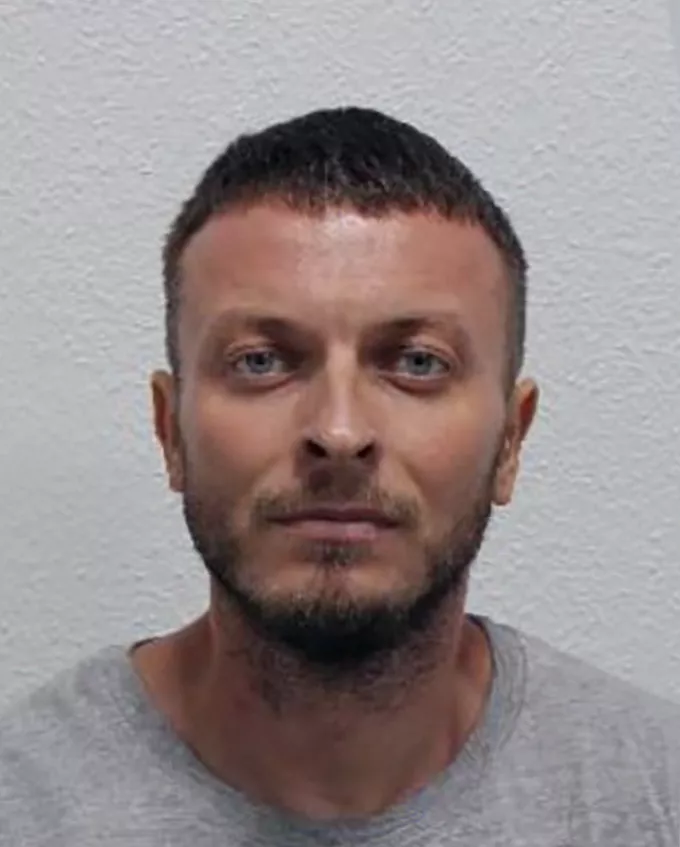 CCTV footage still showing a man leaving a house on the day of the murder.