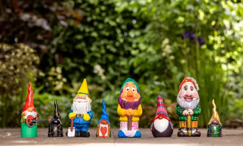 Chelsea Flower Show flowerbed featuring celebrity-painted garden gnomes