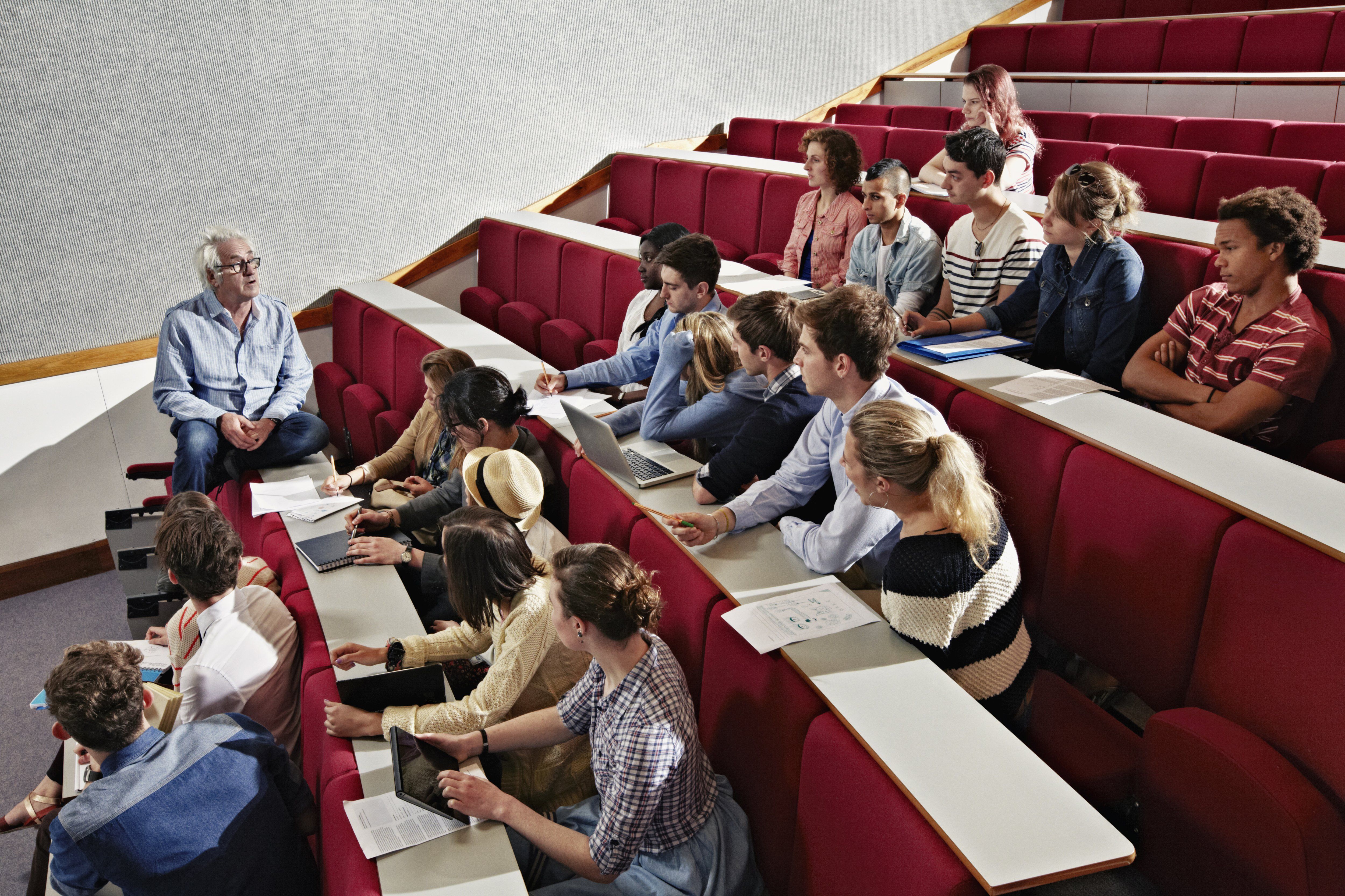 A lecturer holding a content warning slide before a seminar on sensitive topics