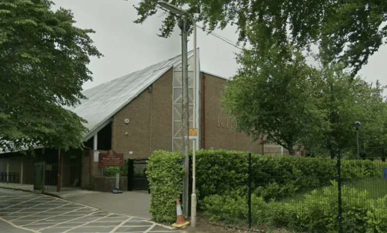 Flowers and candles left at the gates of Kings' School in tribute to a teacher