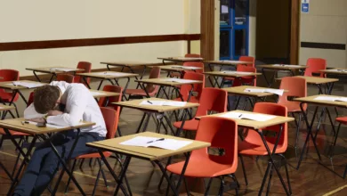 Students leaving a school exam hall after a challenging maths test