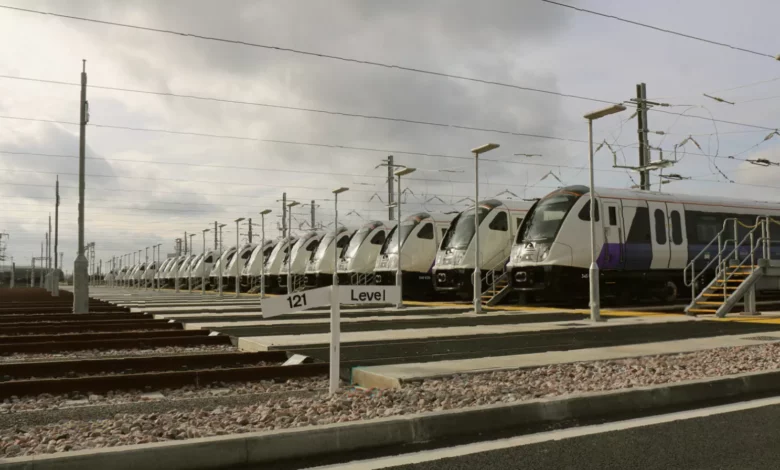 Heathrow Airport rail terminal with passengers boarding a Heathrow Express train