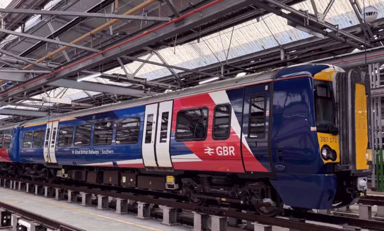 Commuter train arriving at a busy London railway station platform
