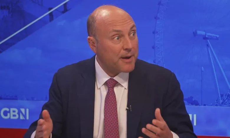Two politicians in a television studio during a heated debate about Brexit