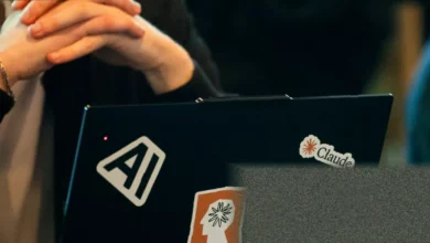 Office workers at computers with screens showing data analytics