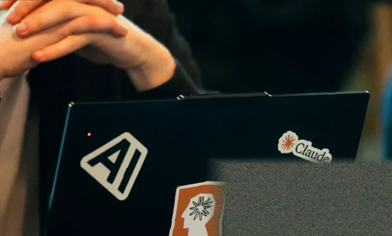 Office workers at computers with screens showing data analytics