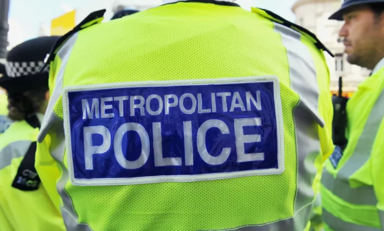 Two men walk into a London courthouse for a hate crime hearing