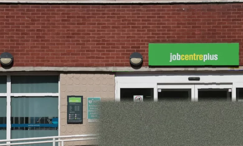 Office workers walking past a job centre in a British city centre