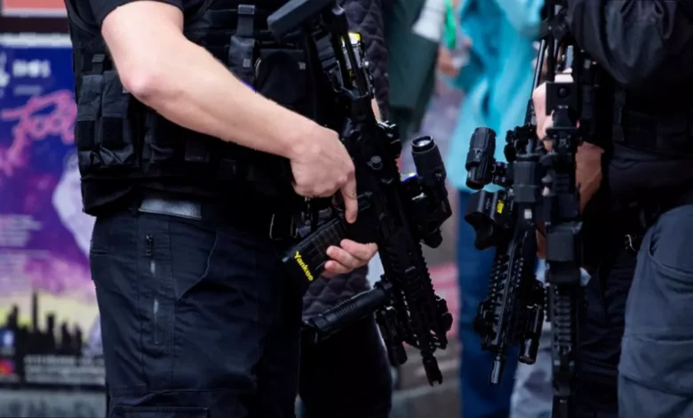 Police officers patrol a street in Golders Green, north London, after a terrorist attack