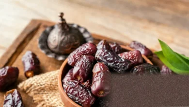 A pile of Medjool dates on a wooden kitchen countertop