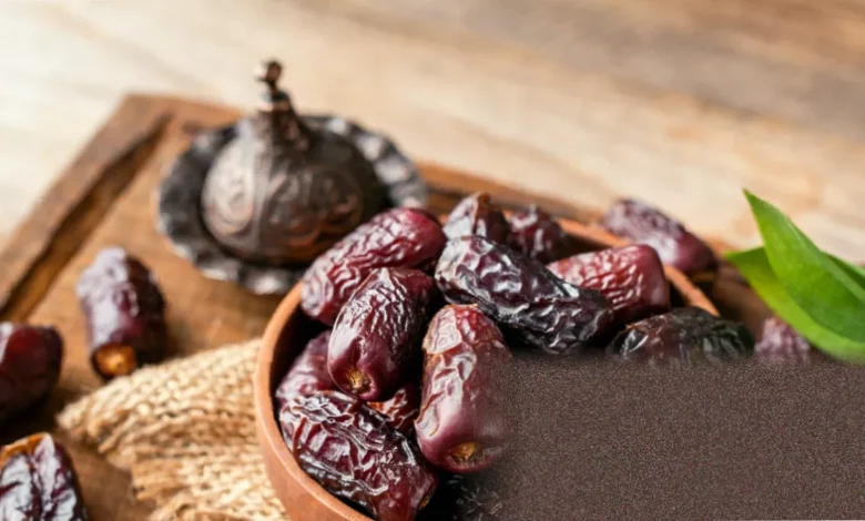 A pile of Medjool dates on a wooden kitchen countertop