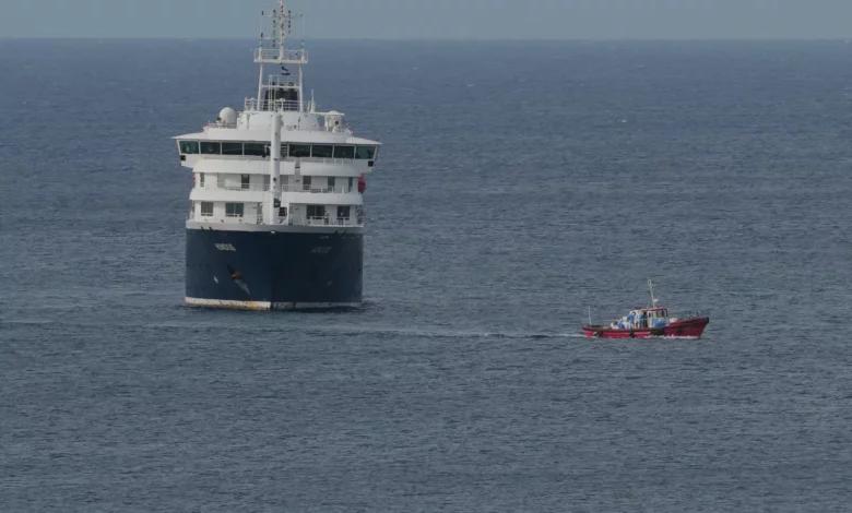 Cruise ship MV Hondius docked at port with medical teams on board