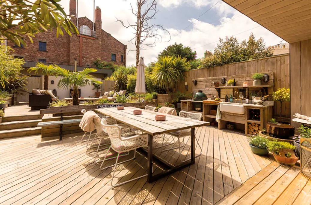 Covered barbecue area and landscaped garden with view over Malvern Hills
