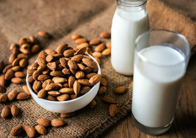 Nutrition label on a carton of fortified almond milk in a kitchen