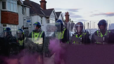 Police officers stand guard near a cordon in Southampton after protests over the Henry Nowak murder case.