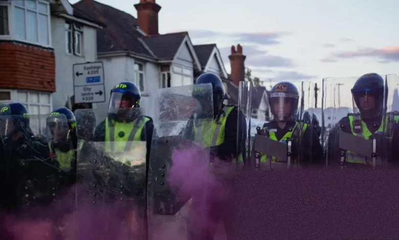Police officers stand guard near a cordon in Southampton after protests over the Henry Nowak murder case.