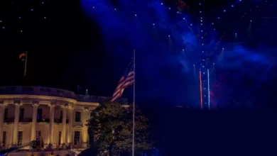 White House South Lawn with a large steel canopy and octagon cage for UFC fights