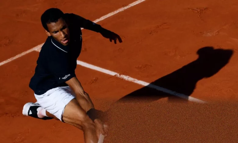 Felix Auger-Aliassime serving during his fourth-round victory at Roland Garros