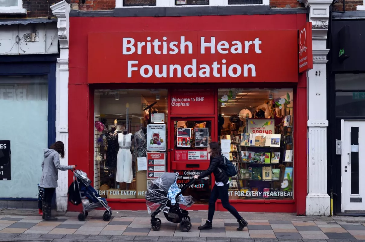 Shelves of donated goods inside a BHF shop with reduced footfall during a cost-of-living crisis