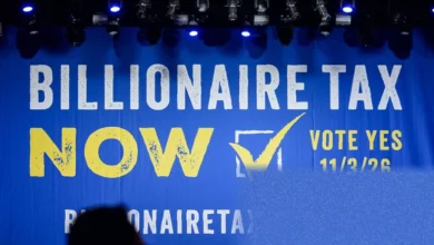 California Secretary of State office confirming the billionaire tax ballot measure with signature piles visible