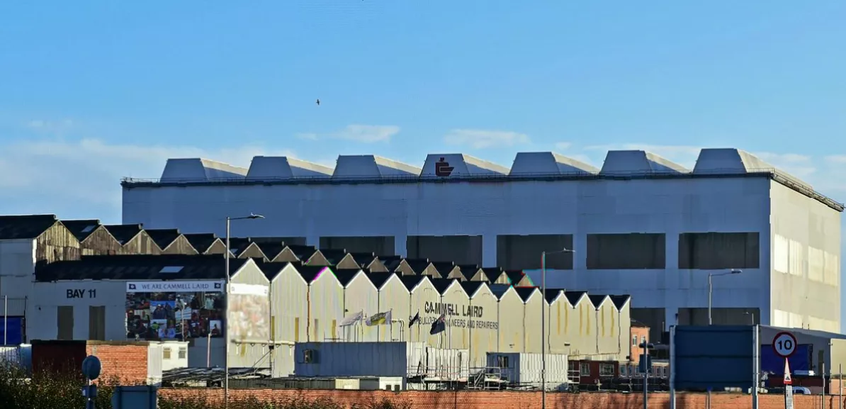 Wide view of a British shipyard showing dry docks and vessel repair facilities