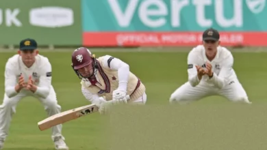 A cricketer walking off the pitch after his final international innings
