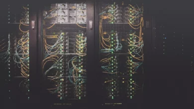 A server rack in a data centre with blinking status lights.