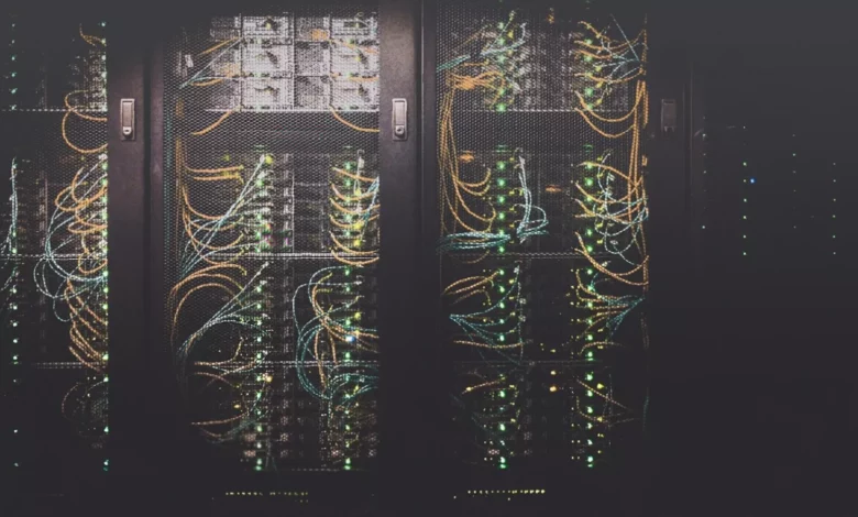 A server rack in a data centre with blinking status lights.