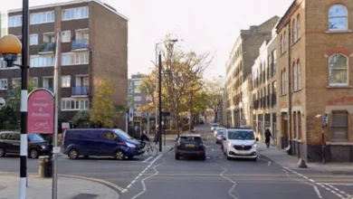 An unmarked black Volvo police car at the scene of a crash on Long Lane in Bermondsey