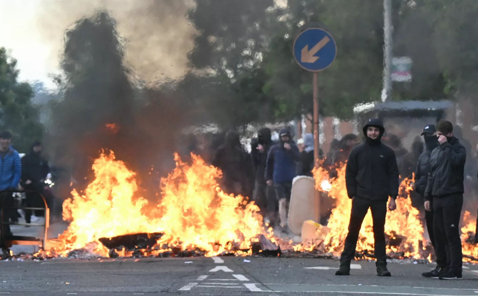 Activists in red boilersuits smashing equipment inside an arms factory