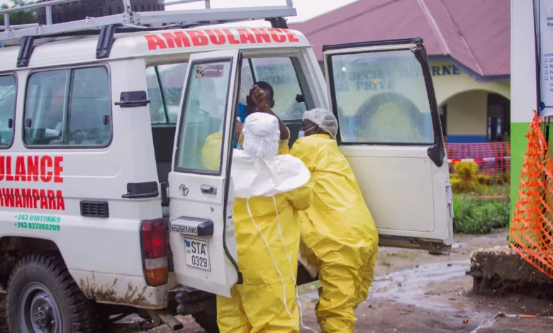 Medical workers in protective suits preparing an isolation unit at a French hospital