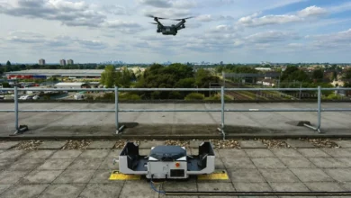 A drone launching from a DJI Dock 3 unit beside Romford railway tracks