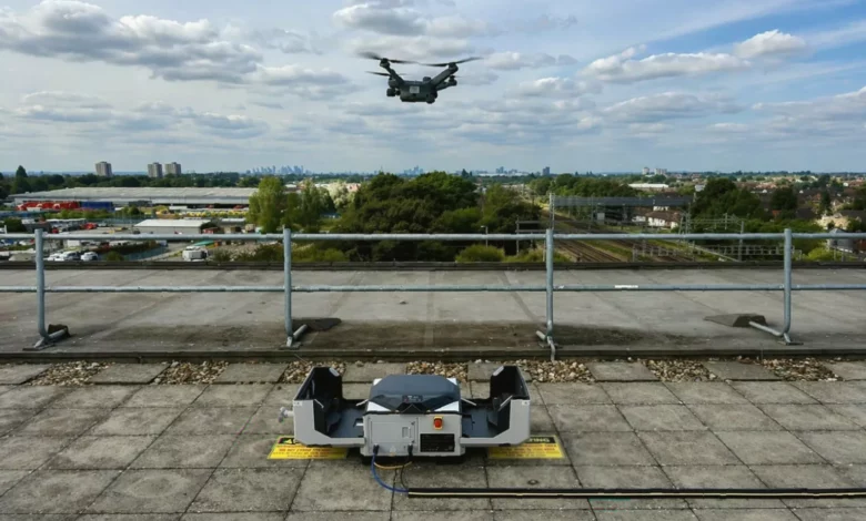 A drone launching from a DJI Dock 3 unit beside Romford railway tracks