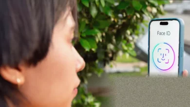 Person unlocking a smartphone with facial recognition for a passkey login