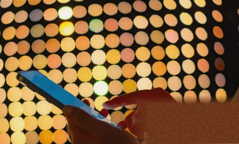 A smartphone displays a passkey login prompt with a fingerprint scan option