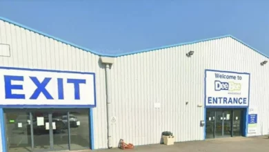 Exterior of a wholesale depot in Grimsby with company signage
